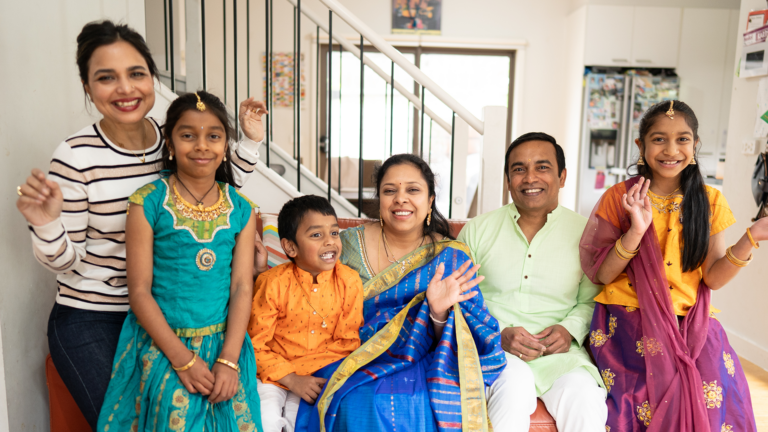 The Nara family featured in the Diwali video series hosted by celebrity chef Kishwar Chowdhury (pictured far left)