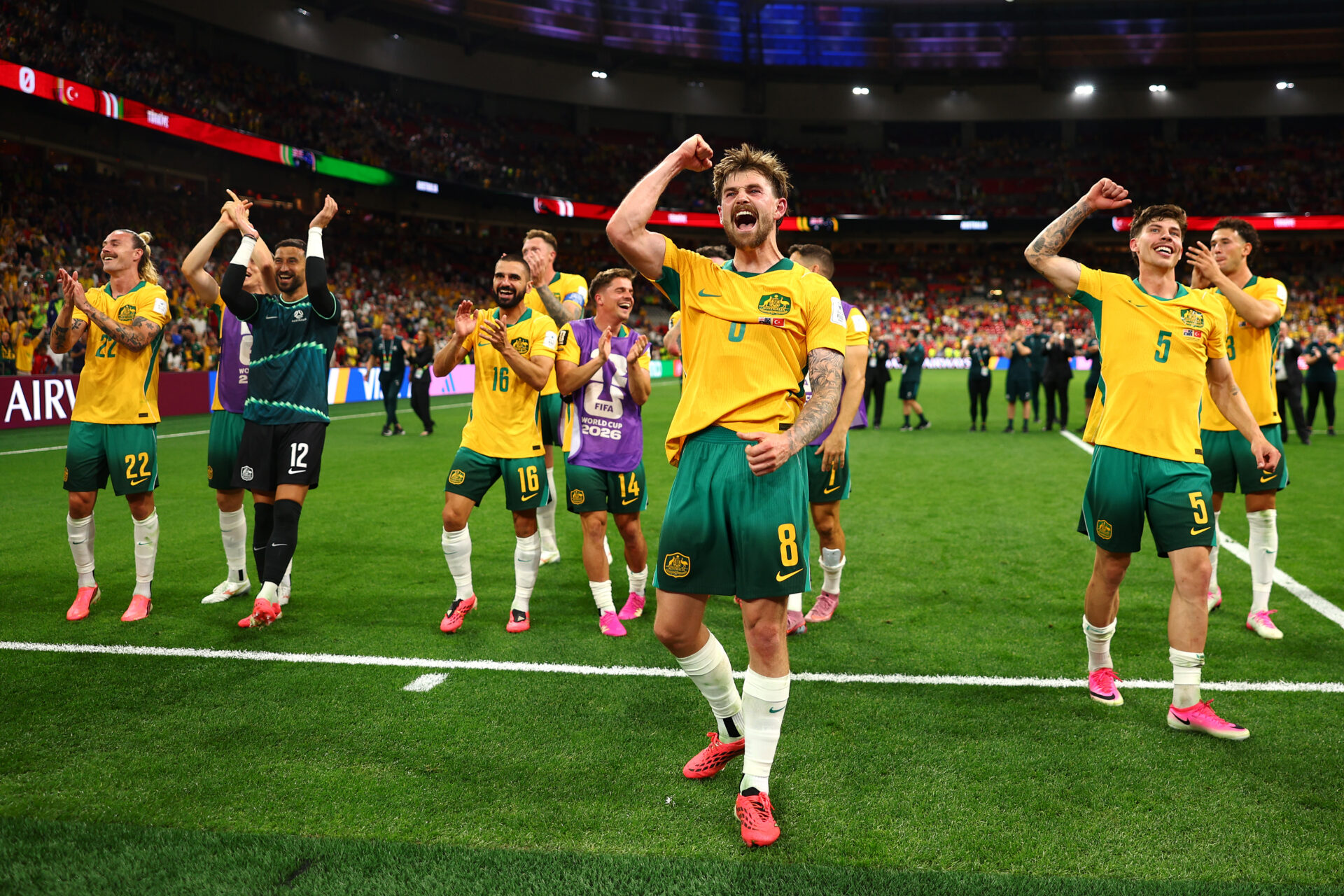 VANCOUVER, BRITISH COLUMBIA - JUNE 13: Connor Metcalfe of Australia leads the celebrations with teammates Jackson Irvine, Paul Izzo, Aziz Behich, Cammy Devlin, Mathew Leckie, Jordan Bos and Alessandro Circati in front of the fans after victory in the FIFA World Cup 2026 Group D match between Australia and Türkiye at BC Place Vancouver on June 13, 2026 in Vancouver, British Columbia. (Photo by Dean Mouhtaropoulos/Getty Images)